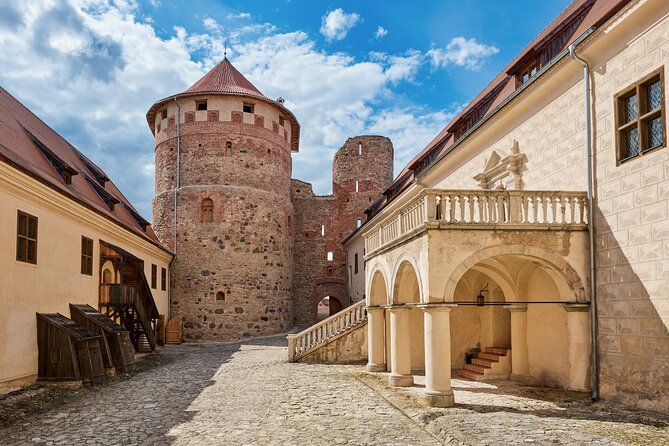 Private Full-Day Trip to Hill of Crosses, Rundale Palace & Bauska - Bauska Castle: Stone walls and river views
