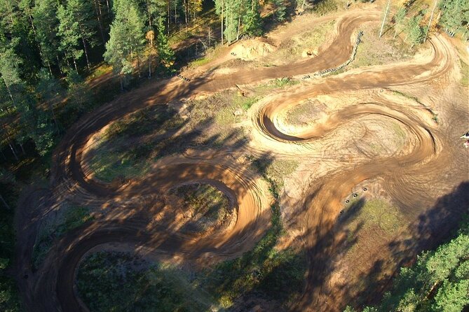 Private Snowmobile or ATV Safari with Riga Black Balsam Tasting - Pine trees, dirt tracks, and a change of pace