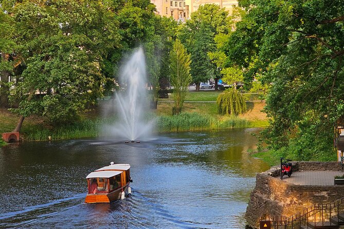 Riga Canal and Daugava Boat Tour with Welcome Drink & Audio Guide - Passing Riga Central Market and its UNESCO setting