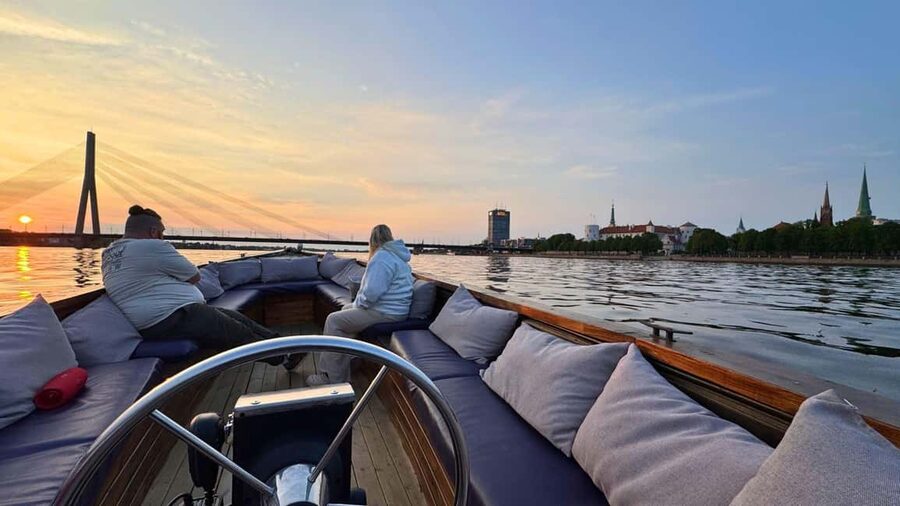 Riga: Canal Boat Tour with Welcome Drink & Audio Guide - Riga Central Market from the canal side