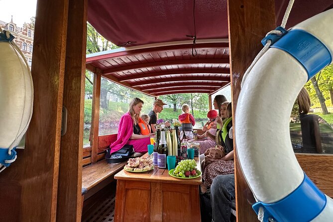Riga: Evening or Sunset Boat Tour with Drink and Audio Guide - Starting at Andrejosta, outside the Old Town