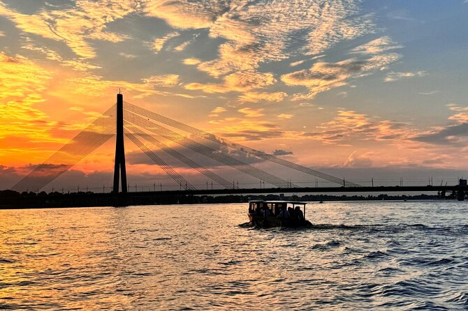 Riga: Evening or Sunset Boat Tour with Drink and Audio Guide - A welcome drink, with a few limits