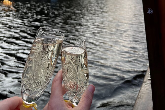 Riga: Evening or Sunset Boat Tour with Drink and Audio Guide - The boat ride’s pace and atmosphere