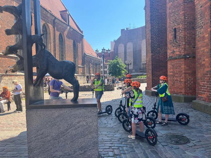 Riga Highlight Big wheel e-scooter Group or Private tour - Along Riga’s green boulevard circle