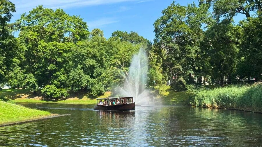 Riga Package: Canal Boat Tour + Drink & Old Town Audio Guide - Leaving Andrejosta and passing Kronvalda Park