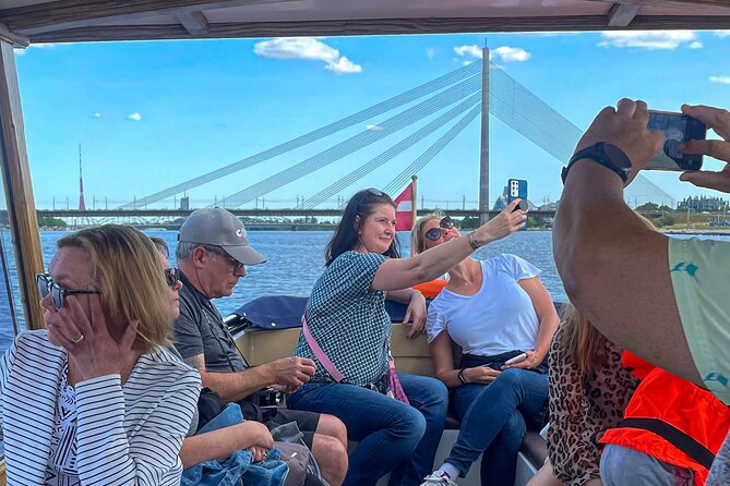 Riga Sightseeing Tour by Canal Boat with Audioguide - Central Market and the National Library